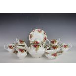 A Royal Albert Old Country Roses tea service comprising; four teacups and saucers, four mugs,