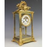 A 19th century French ormolu and lacquered brass four glass eight day mantle clock,