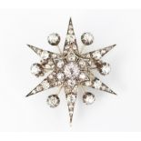 A Victorian diamond set star pendant/brooch,