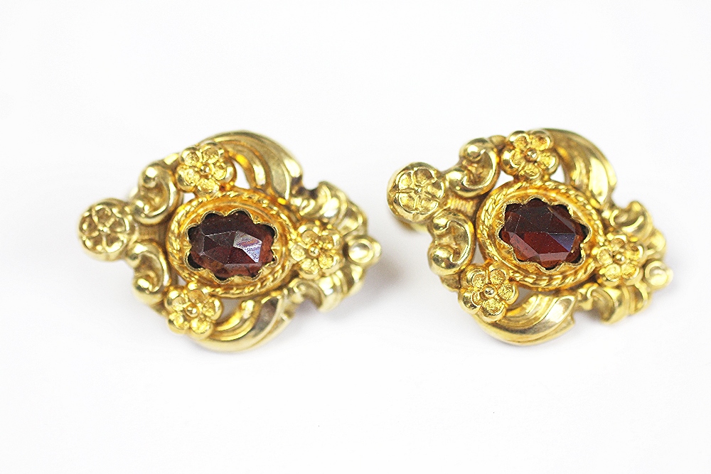 A pair of gold and garnet earrings screw earrings,