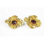 A pair of gold and garnet earrings screw earrings,