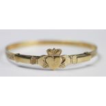 A 9ct yellow gold Claddagh bangle, Birmingham 1991,