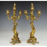 A pair of gilt bronze Rococo style three branch candelabrum,