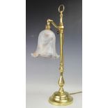 A modern adjustable brass lamp,