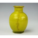 A Chinese monochrome yellow vase, the ovoid body with craquelure glaze throughout, 9.