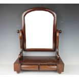 A Victorian mahogany dressing table mirror above two drawers,