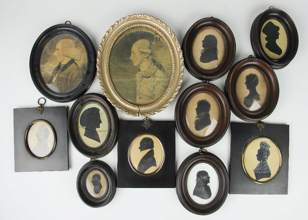 A collection of 18th century and later family silhouettes and oval pencil portraits to include