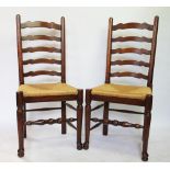 A set of six 19th century style oak ladder back chairs, with drop in rush seats,