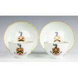 A pair of Lowestoft armorial porcelain tea bowls and saucers, circa 1790,