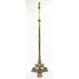 A Victorian lacquered brass standard lamp, with Acanthus leaf detailing,