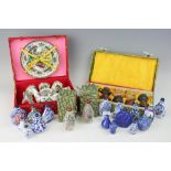 A selection of cased collectable Chinese ceramics,