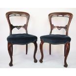 A set of six Victorian carved mahogany dining chairs, with blue upholstered seat,