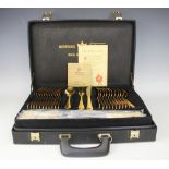 A Bestecke Solingen gold plated canteen; comprising twelve dinner forks, twelve dinner knives,