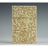 A 19th century Cantonese carved ivory calling card case, decorated with figures, pagodas and trees,