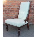 An Edwardian walnut salon chair, with modern lilac and green upholstery,