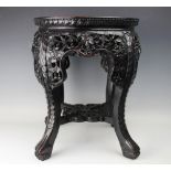 A Chinese carved hardwood low table / jardiniere stand,