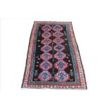 An Iranian Bokhara design wool carpet,