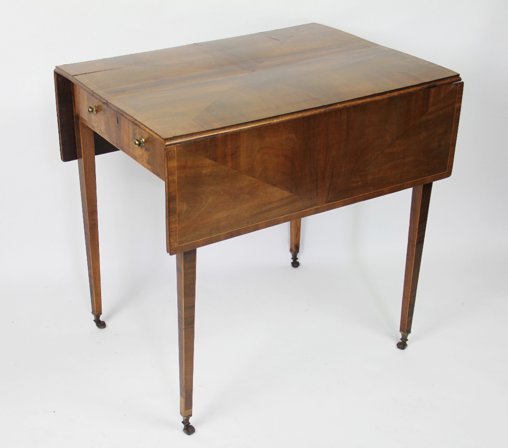 A late George III mahogany Pembroke table, with geometric veneered top, above a drawer,