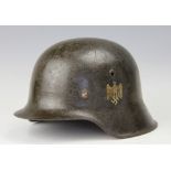 A WWII M35 NS64 type German Army/Heer single decal helmet, there are two stamped numbers,