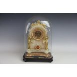 A late 19th century French gilt metal mounted alabaster mantel time piece,