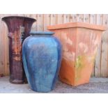 A selection of three garden vases/planters, comprising a large ovoid blue glazed example,