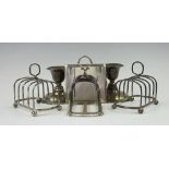 A pair of silver toast racks, London 1937, another silver toast rack, Goldsmiths Company,