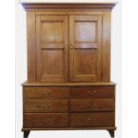 A Victorian pine housekeepers or kitchen cabinet, with moulded cornice above two panelled doors,