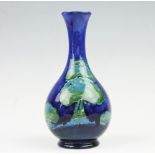 A Moorcroft Moonlit Blue pattern bottle vase, circa 1920,