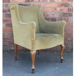 A pair of 1920's library tub chairs, with green upholstery, on cabriole legs,