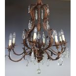 A modern Louis XV style bronzed metal eight light chandelier decorated throughout with scrolling