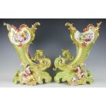 A large pair of Continental cornucopia figural vases, hand painted with flowers and gilt throughout,