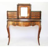 A Victorian inlaid walnut serpentine bonheur de jour, with mirrored door and six small drawers,
