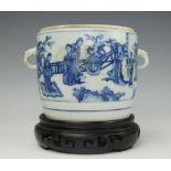 A Chinese porcelain blue and white jar on carved hardwood stand,