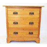 An Edwardian pine chest, on three graduated long drawers, on bracket feet,