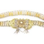 A Continental white and yellow metal filligree belt,