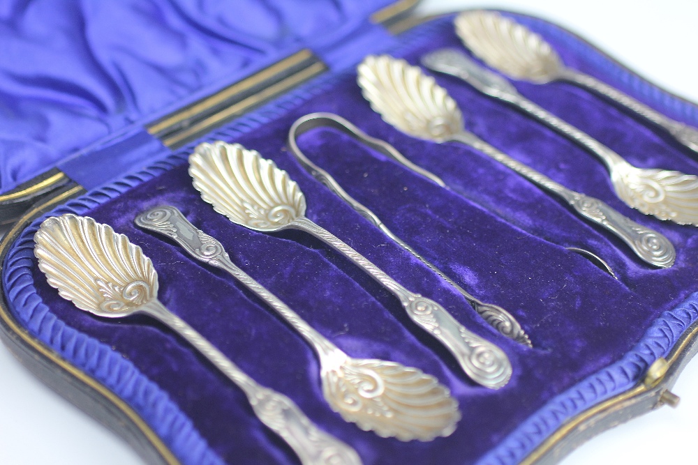 A Victorian cased set of six silver teaspoons and matching sugar tongs, Sheffield 1890,