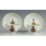 A pair of Lowestoft armorial porcelain tea bowls and saucers, circa 1790,