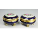 A pair of Austrian porcelain circular boxes and covers,