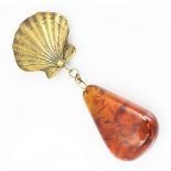 A large 'Amber' pendant and attached gilt metal clam shell pendant, stamped 'Sterling',