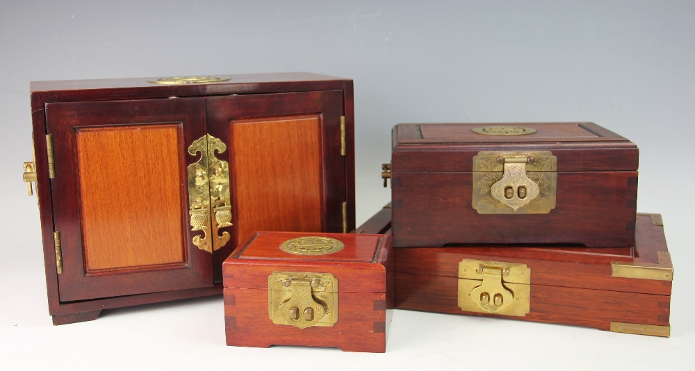 A Chinese brass mounted camphor wood table cabinet,