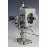 A collection of Reichert lens and eye pieces, various attachments and fittings, a stage,