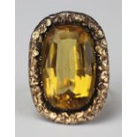 A 19th century citrine set ring, the central mixed cut,