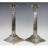 A pair of Sheffield plate Corinthian column candlesticks, early 20th century,