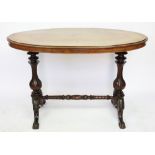 A Victorian walnut oval centre table, with turned and carved legs,