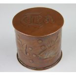 A Newlyn copper circular tea caddy,
