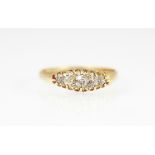 A five stone diamond ring, the five graduated diamonds,