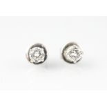 A pair of diamond set stud earrings, each brilliant cut diamond (of approx 0.
