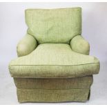 A green upholstered salon chair,