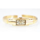 A 'Surena Geneve' ladies wristwatch/bangle, the rectangular face with part Arabic numerals,
