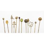 Twelve assorted stick pins, to include; garnet, pearl, peridot,